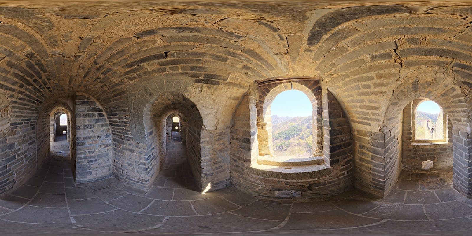 Panoramic view of the Mutianyu Great Wall across forested Beijing mountains