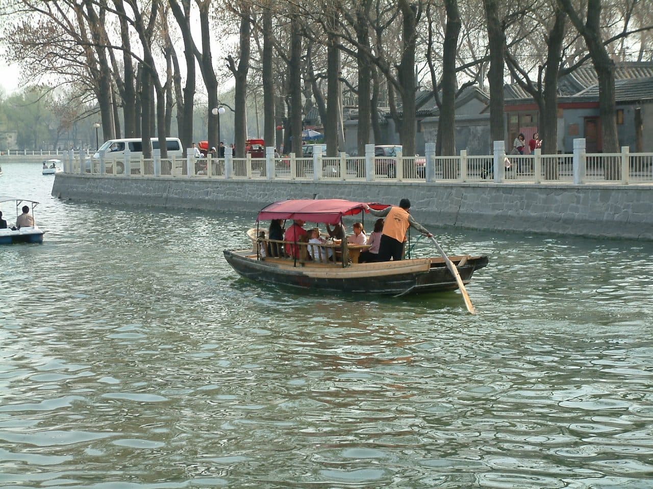 Daytime view across Shichahai lake and historic Beijing buildings