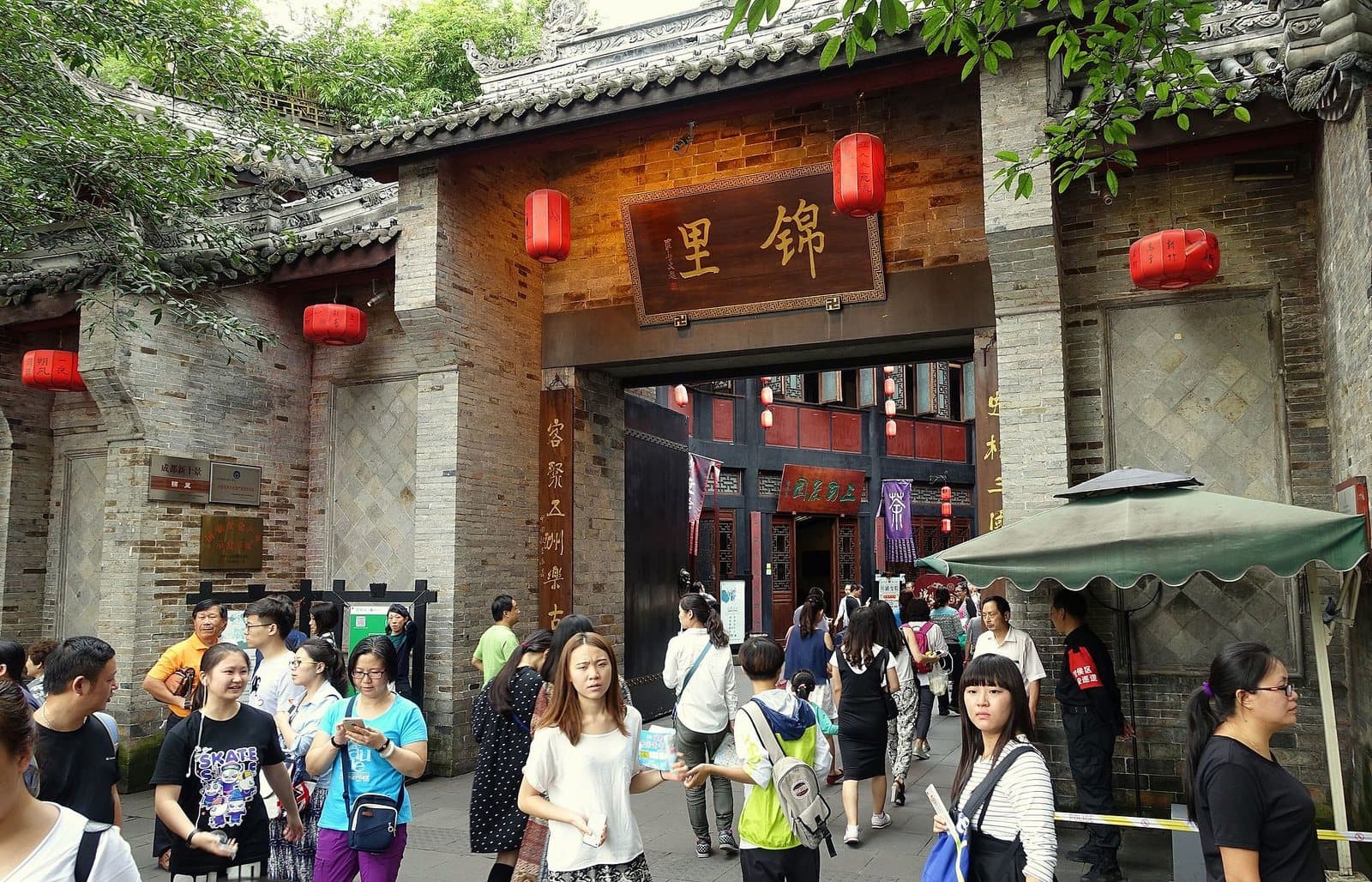 Traditional storefronts and evening lanterns on Chengdu's Jinli Street — view 1
