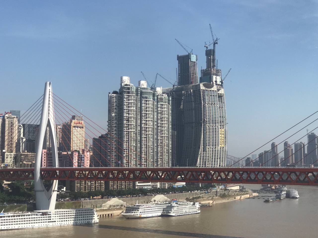 Raffles City skyline at Chongqing's Chaotianmen river confluence — view 1