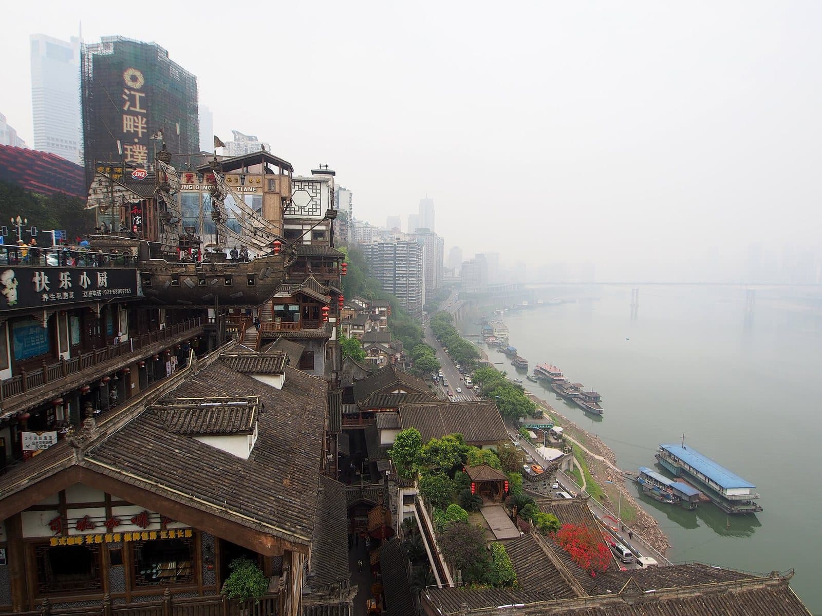 Hongya Cave illuminated above the river in Chongqing — view 3