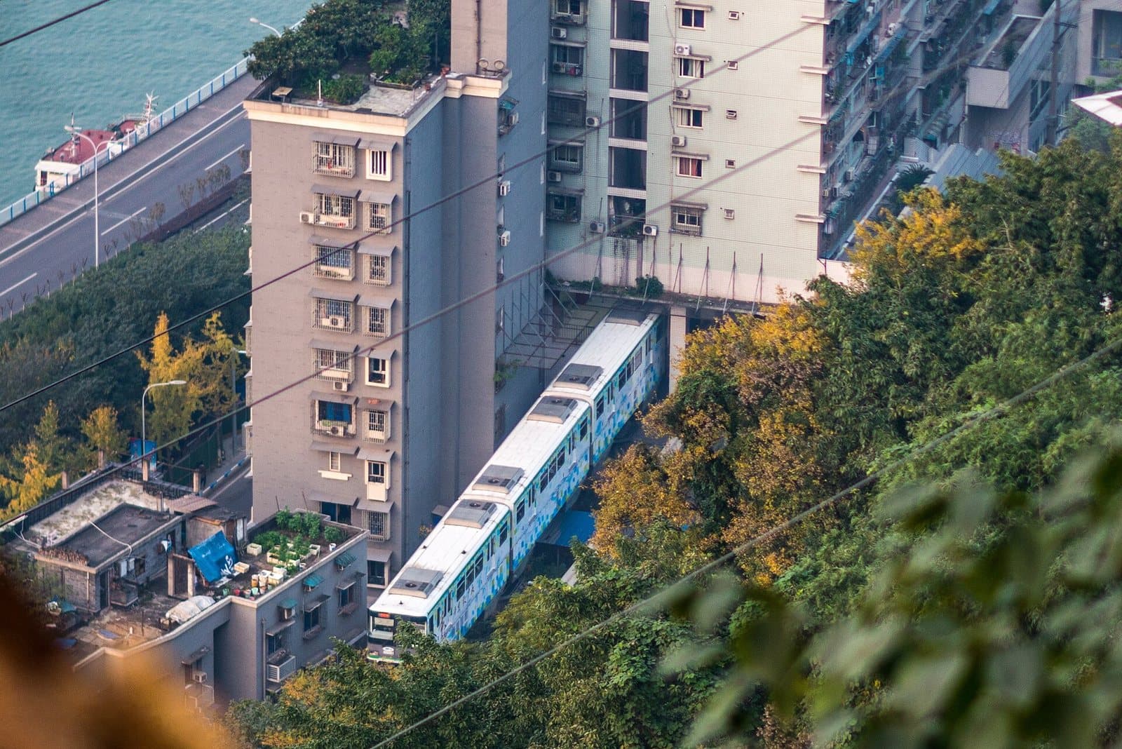 Chongqing monorail passing through Liziba station building — view 1