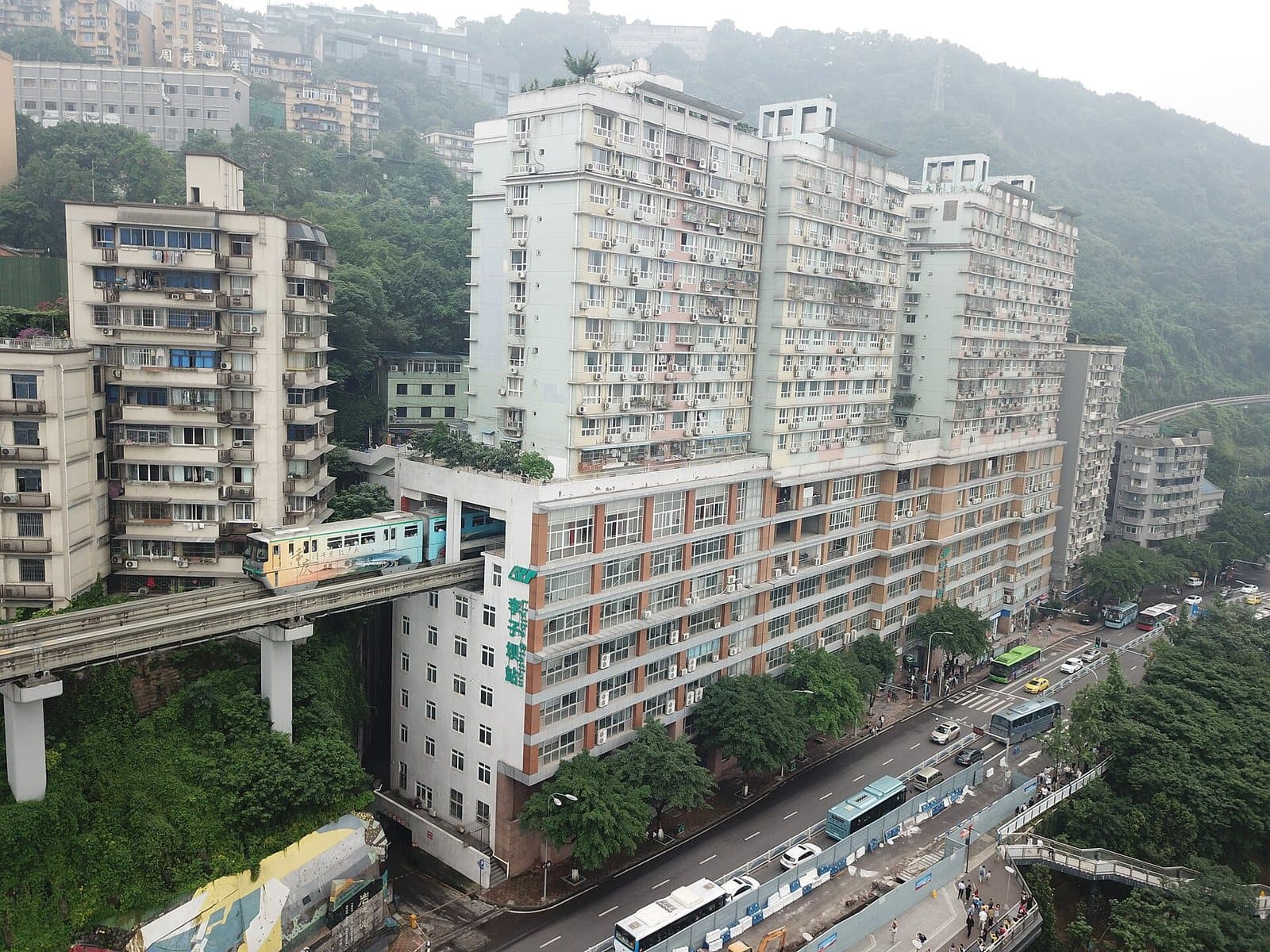 Chongqing monorail passing through Liziba station building — view 2