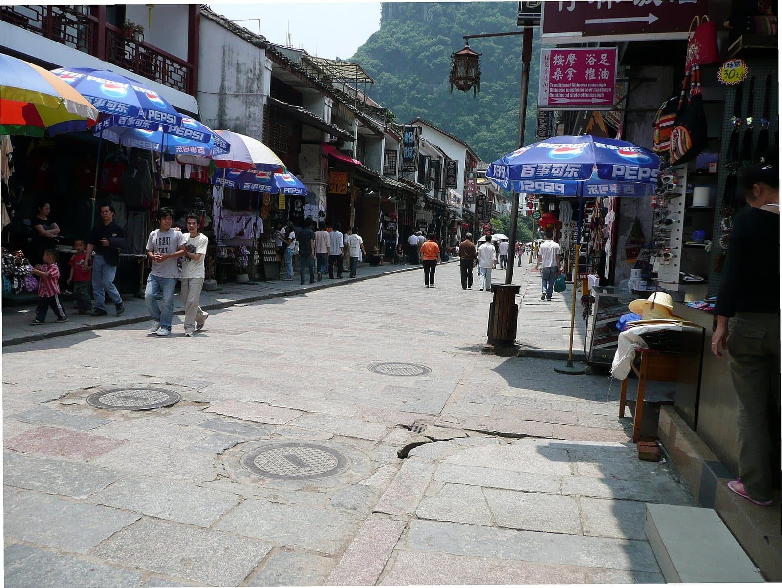 Pedestrian lanes, shops and evening lights on Yangshuo West Street — view 1