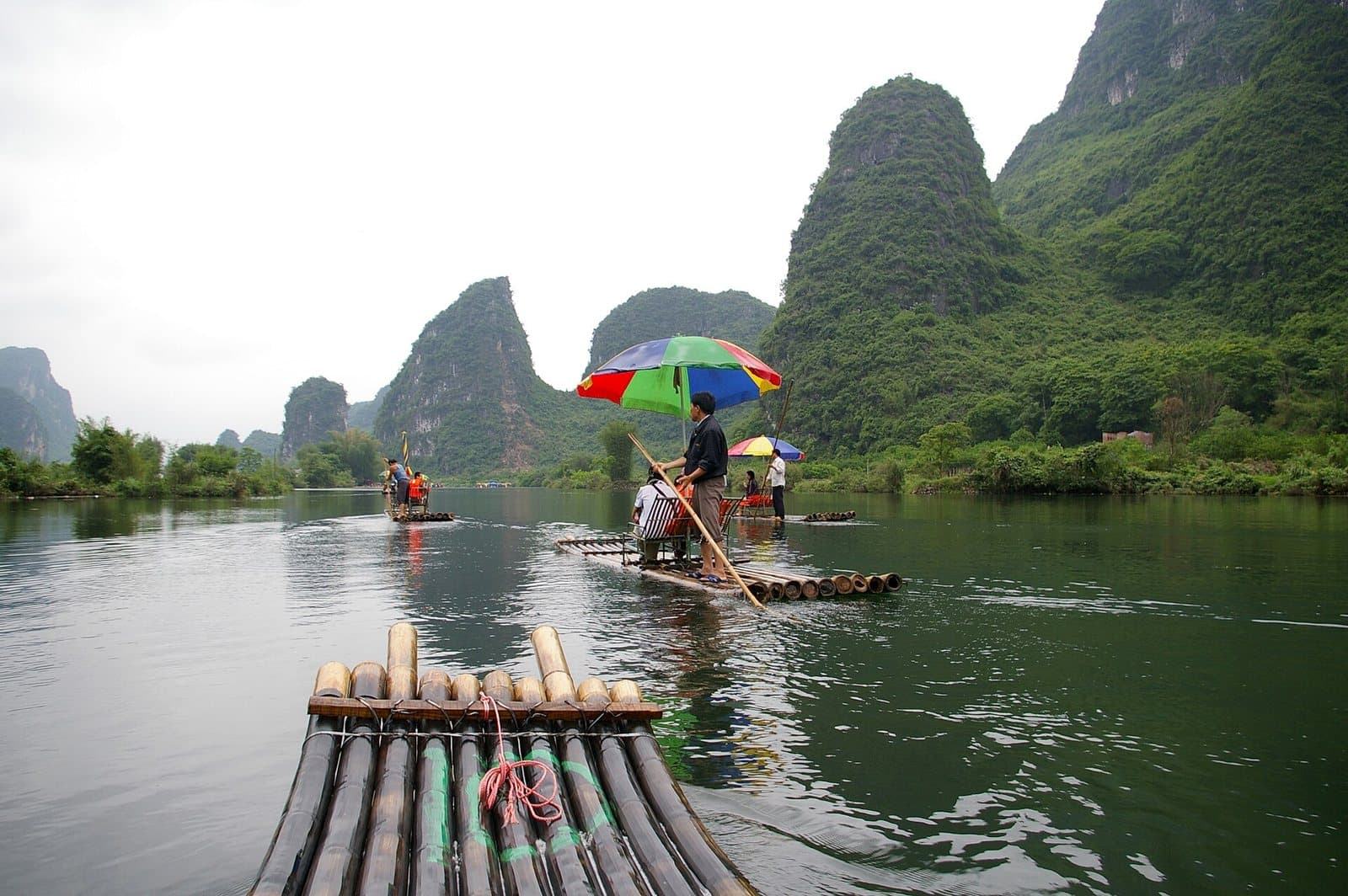 Bamboo rafts, bridges and karst peaks on the Yulong River — view 1