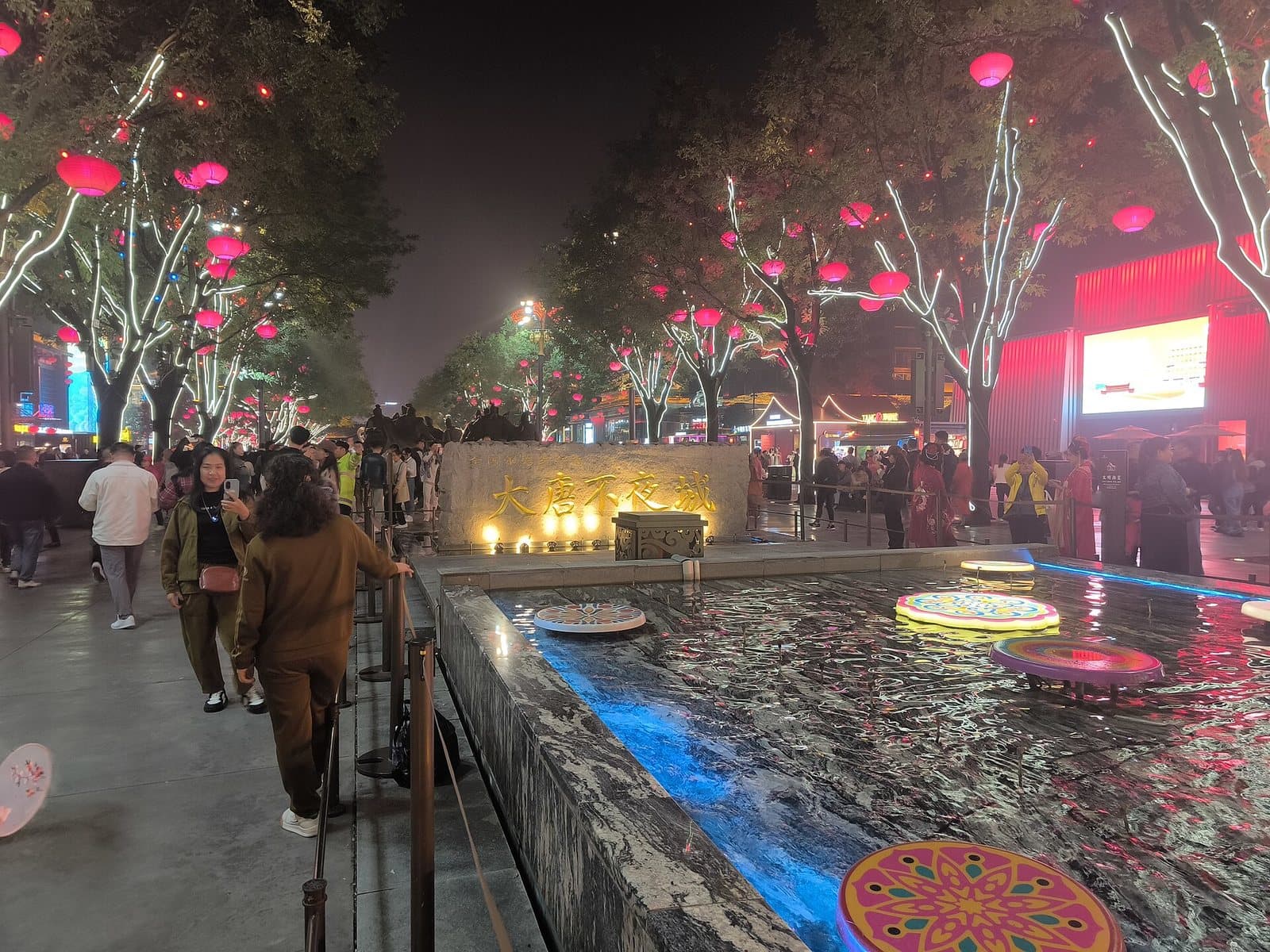 Tang-inspired pedestrian avenue and evening lights at Grand Tang Mall — view 2