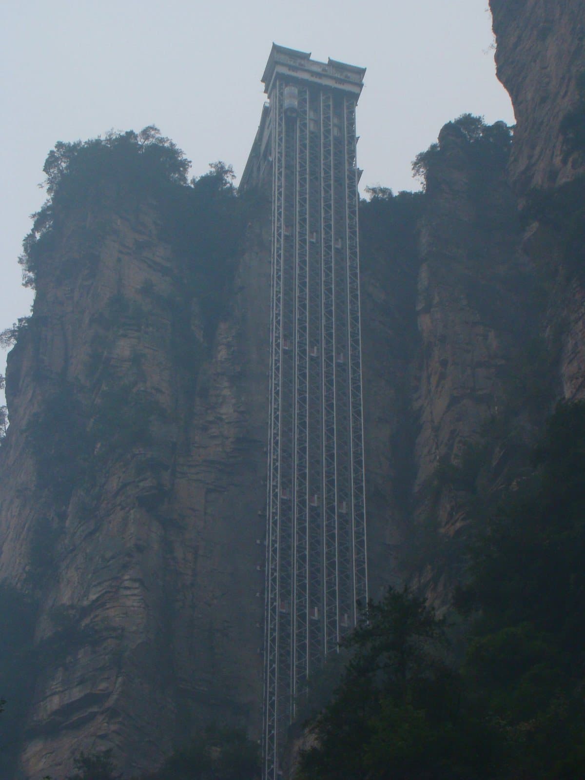 Bailong Elevator rising beside Zhangjiajie's sandstone cliffs — view 2