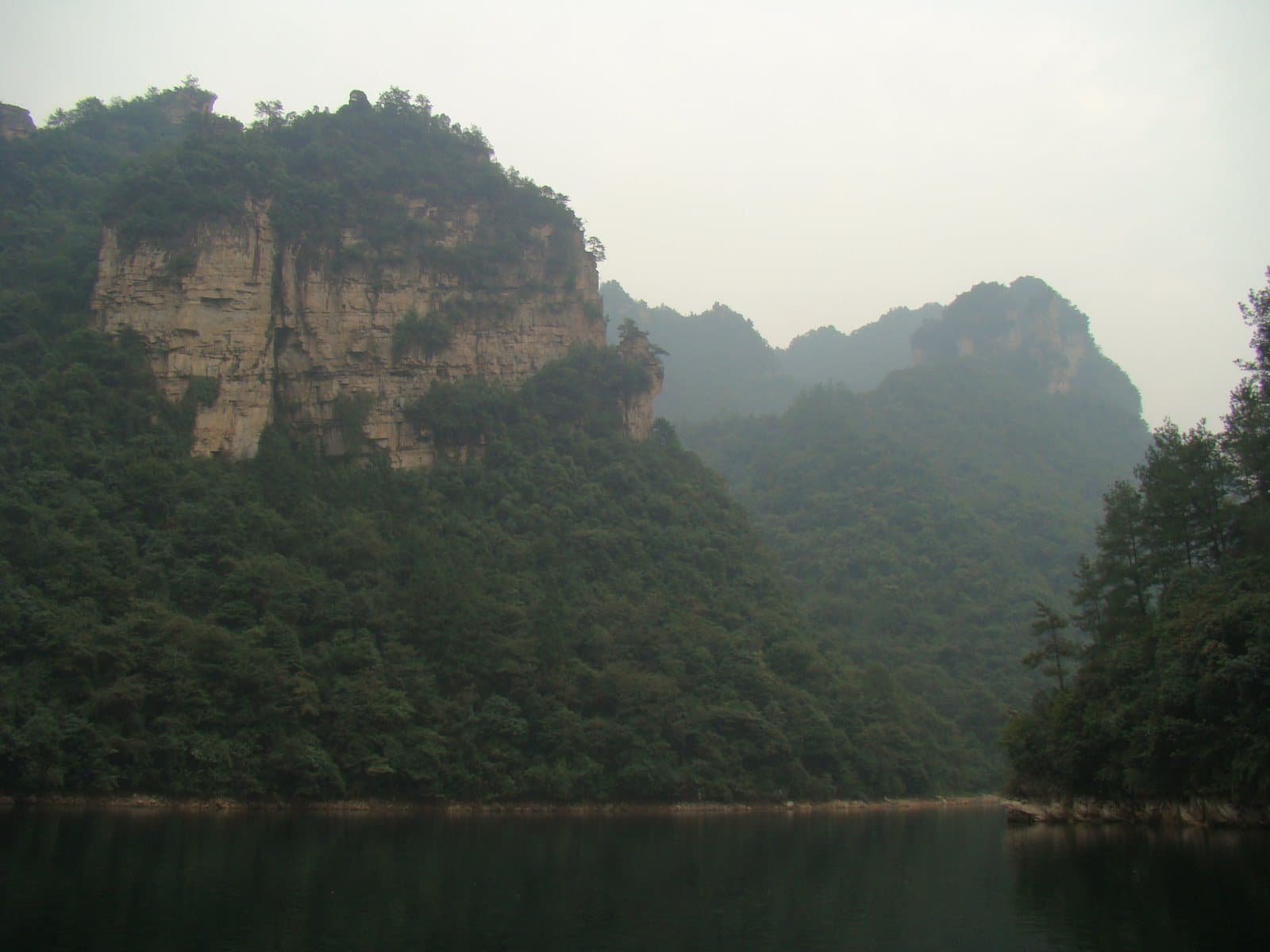 Mountain lake and forested cliffs at Baofeng Lake — view 3