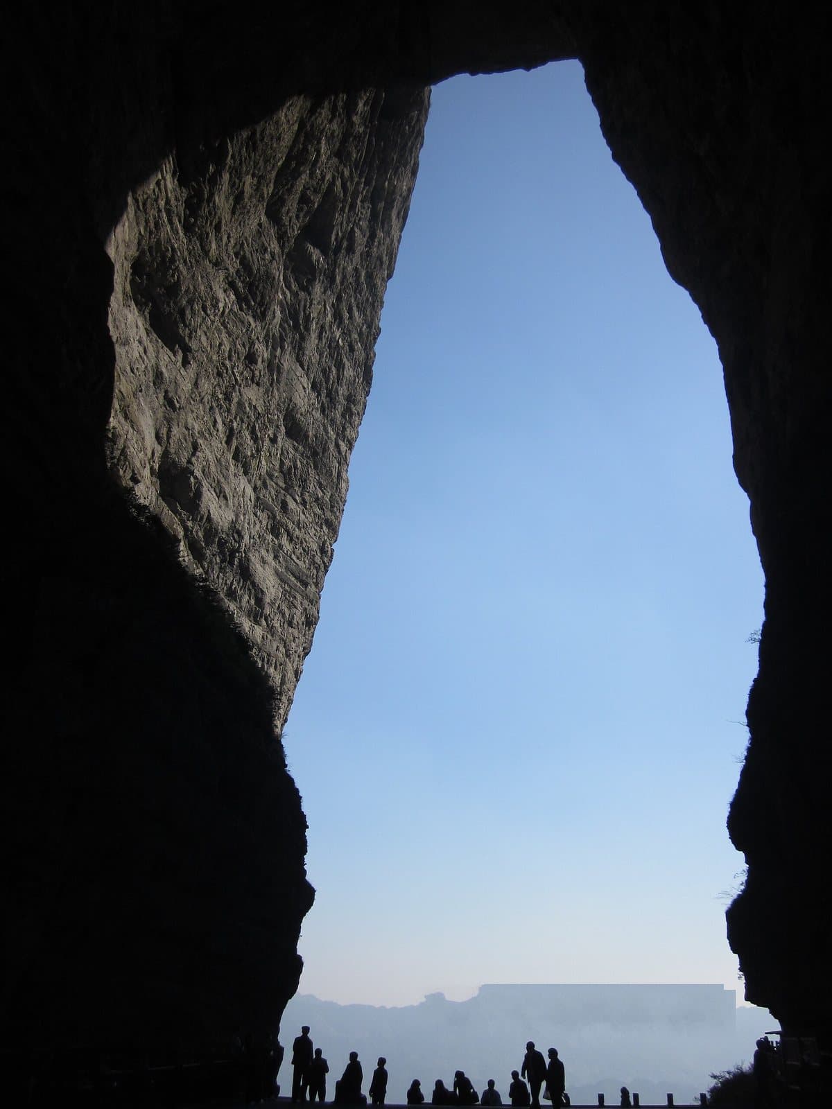 The natural arch and stairway at Tianmen Cave — view 1