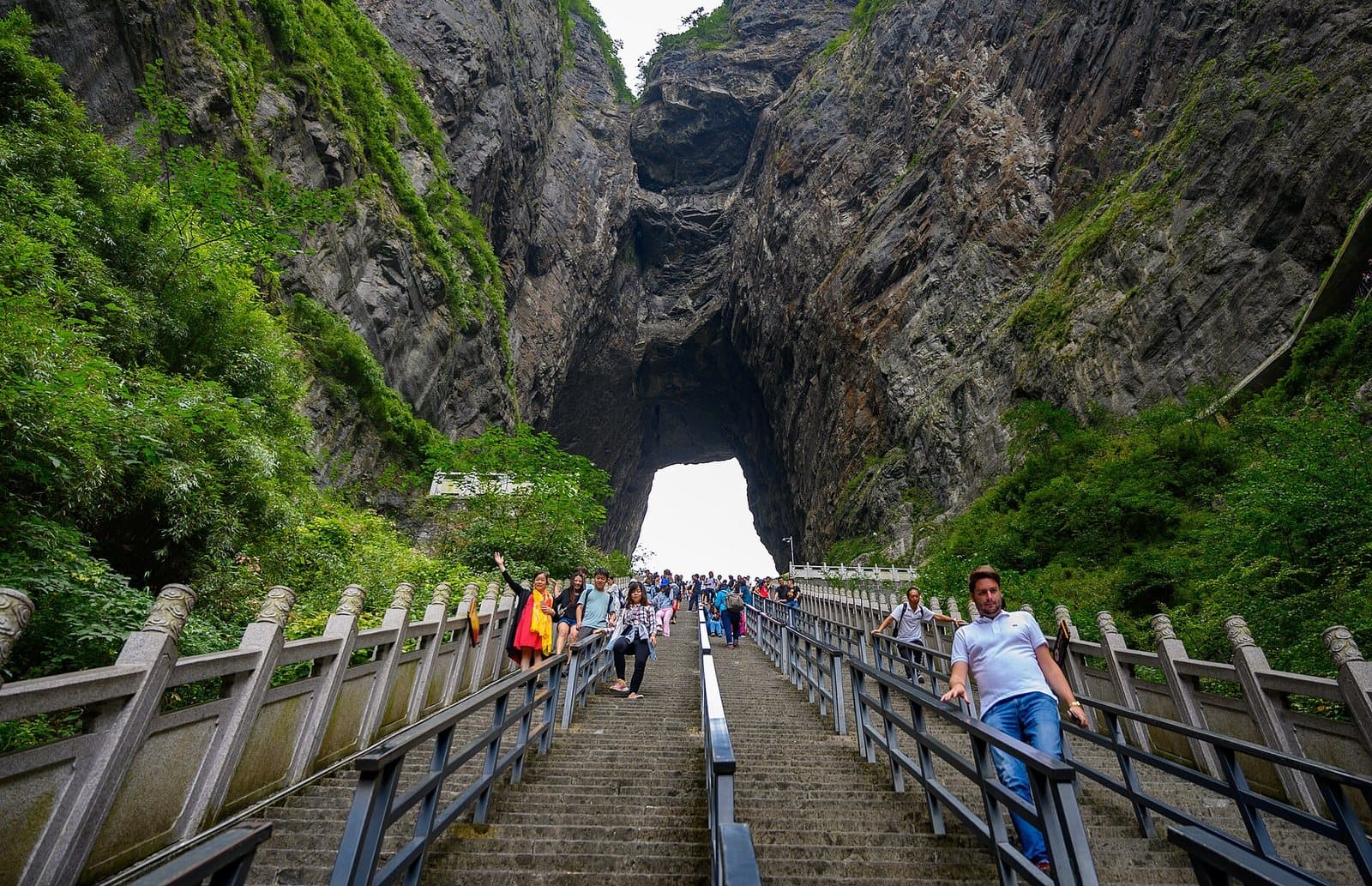 The natural arch and stairway at Tianmen Cave — view 3