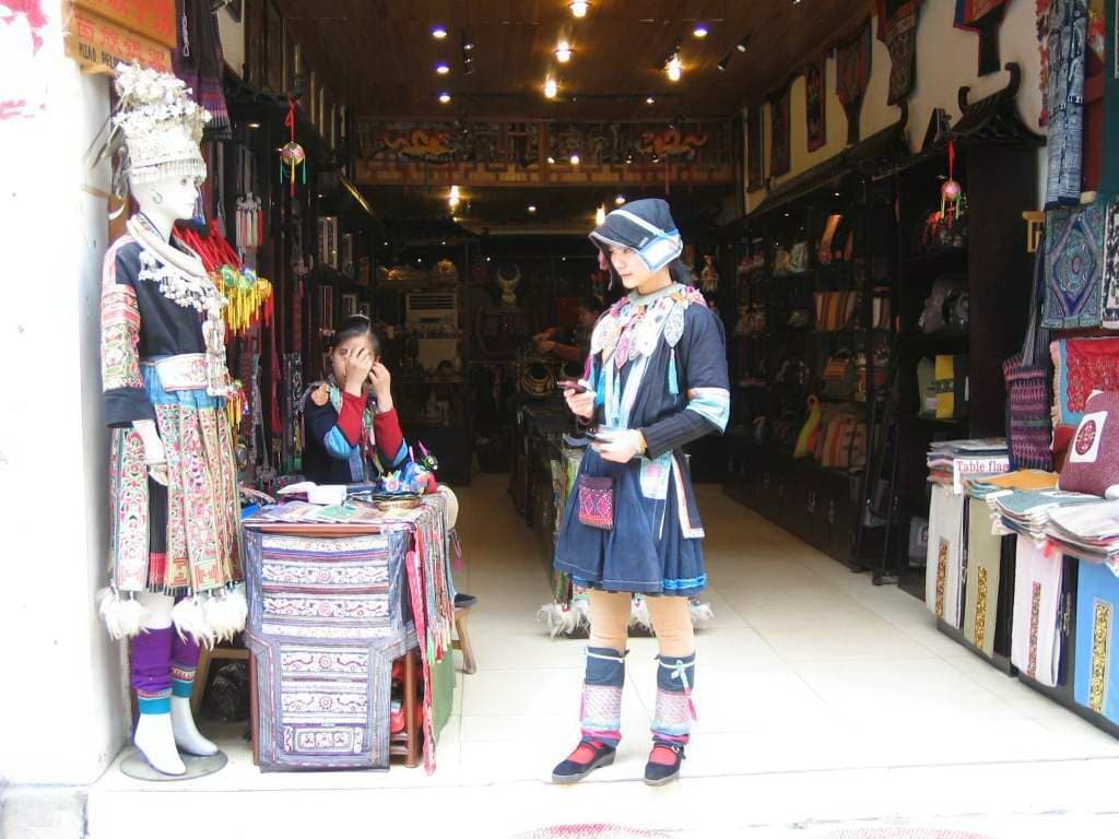 Pedestrian lanes, shops and evening lights on Yangshuo West Street — view 2