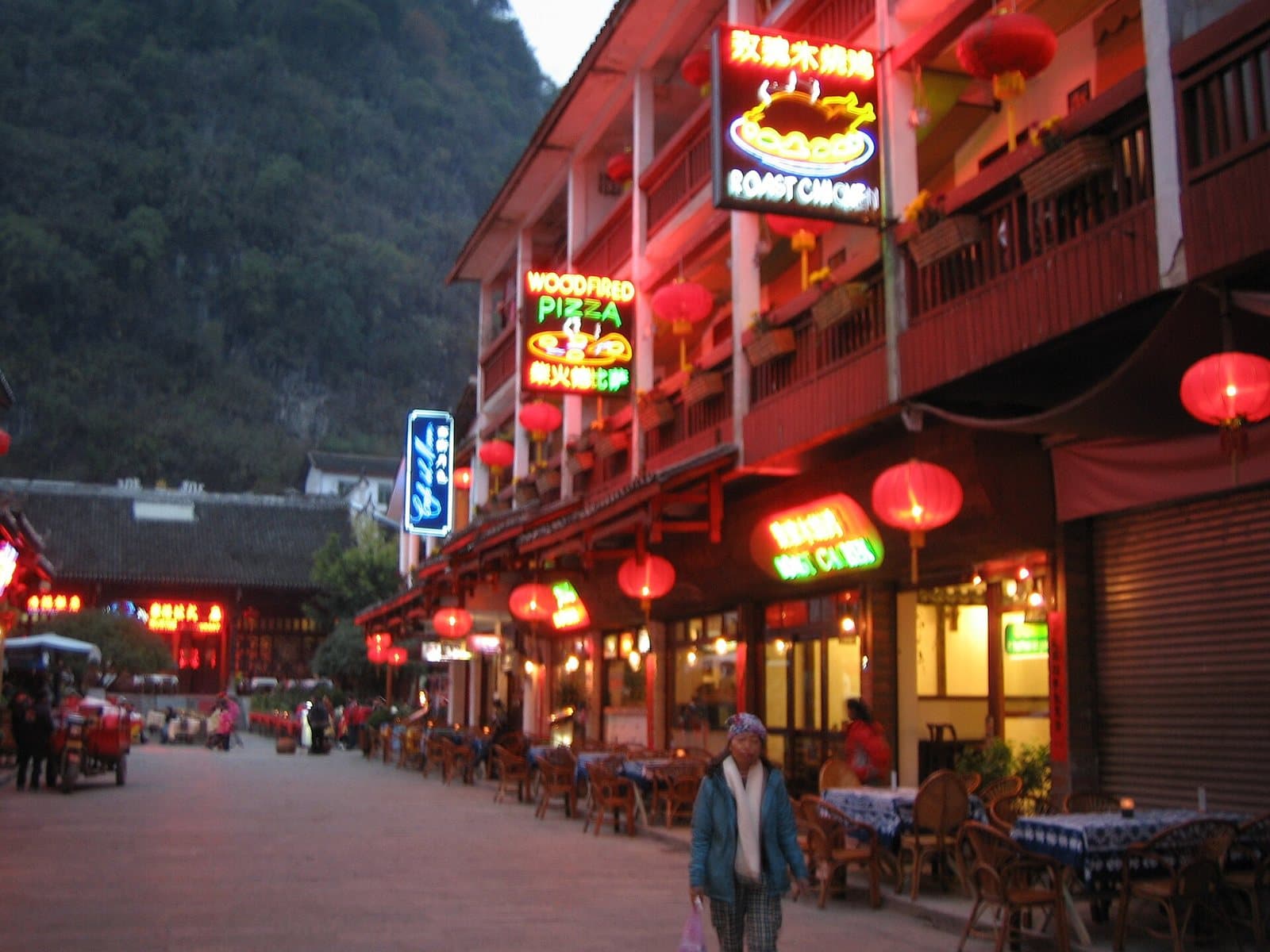 Pedestrian lanes, shops and evening lights on Yangshuo West Street — view 3